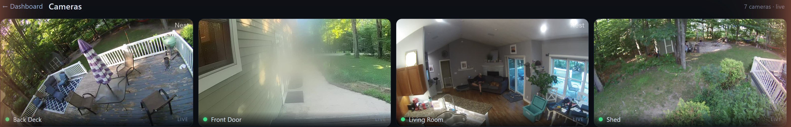 Aria's live cameras page — back deck, front door, living room, and shed cameras streaming live side by side
